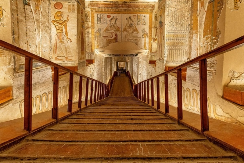 Painted tomb corridor with a wooden walkway in the Valley of the Kings