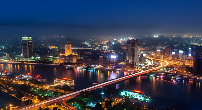 Cairo and the Nile at night with light trails on the bridge Cairo and the Nile at night with light trails on the bridge