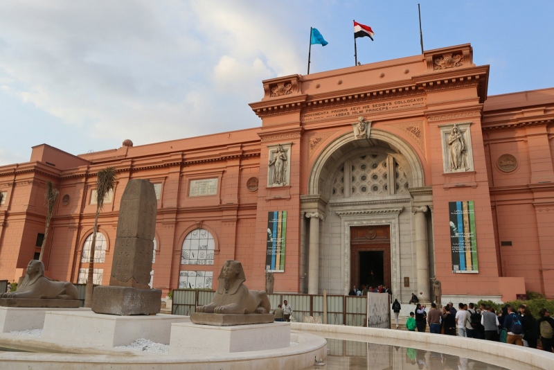 The red-brown facade of the Egyptian Museum on Tahrir Square in Cairo