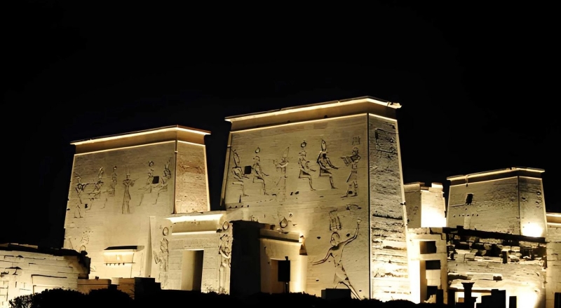 The pylons of Philae Temple lit up at night in Aswan